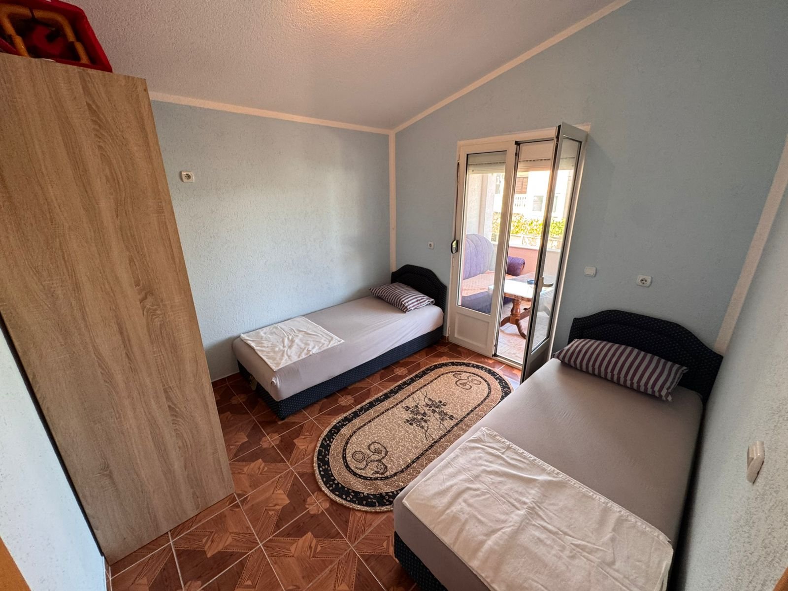 Charming Ulcinj bedroom&acirc;two single beds, modern wardrobe, patio access. Ideal Montenegro investment. Eksphere doo via immorenta.me.