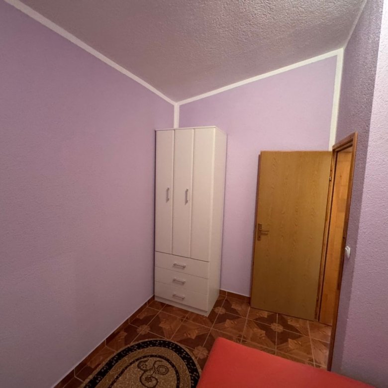 Modern small room in Ulcinj: light purple walls, stylish white wardrobe, tiled floor&acirc;ideal Montenegro property at immorenta.me by ekosphere doo.