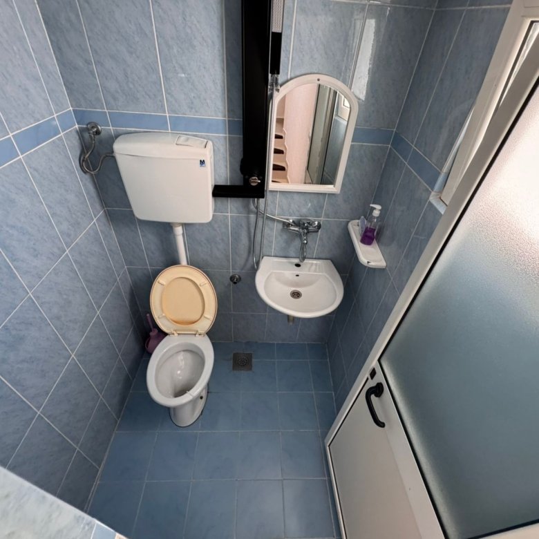 Invest in Ulcinj! Modern blue-tiled bathroom with eco shower, quality fixtures. An ekosphere doo project on immorenta.me.