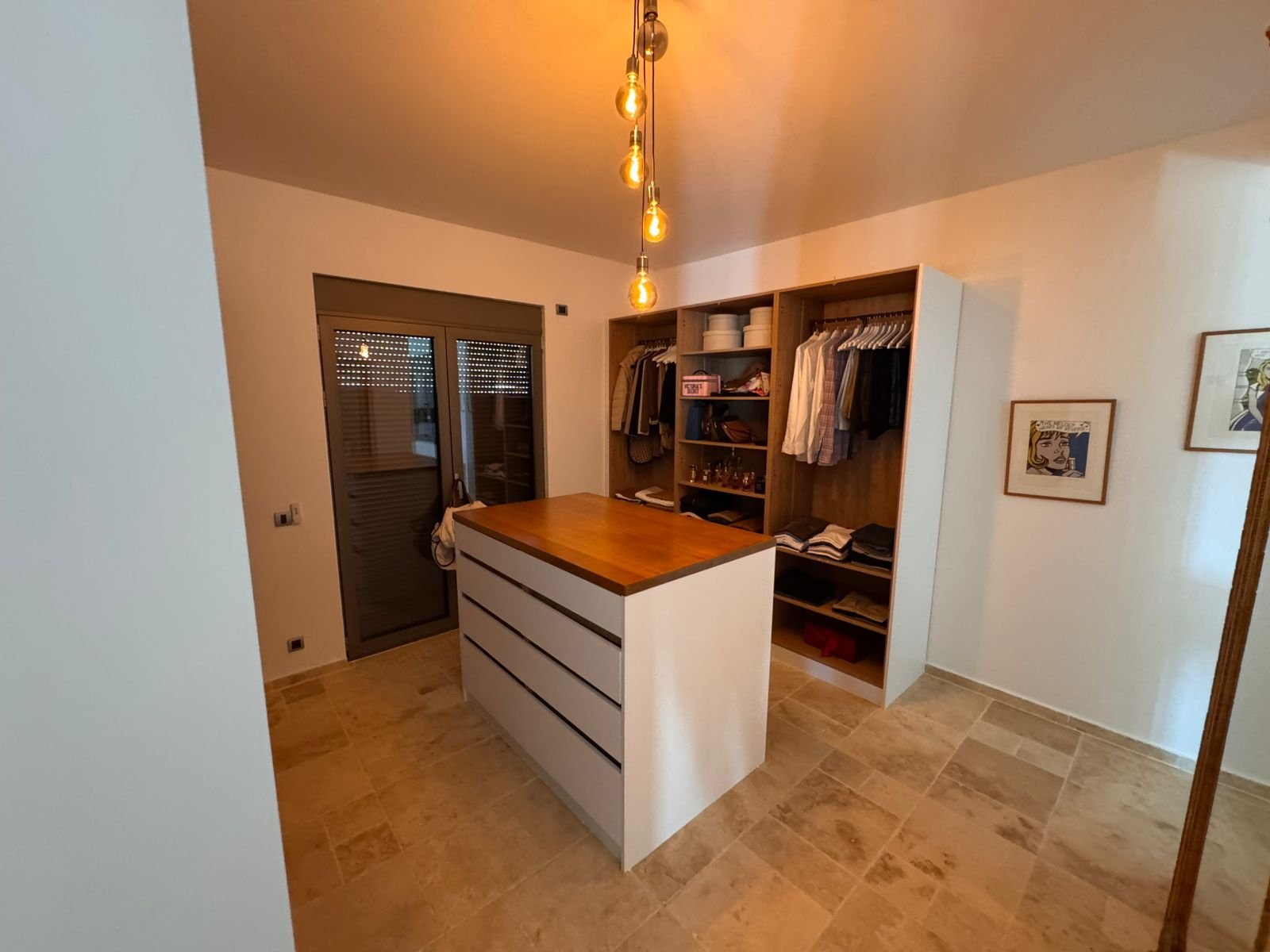 Luxurious walk-in closet in Ulcinj, Montenegro&mdash;spacious island, elegant lighting, ideal for investment. On immorenta.me by ekosphere doo.