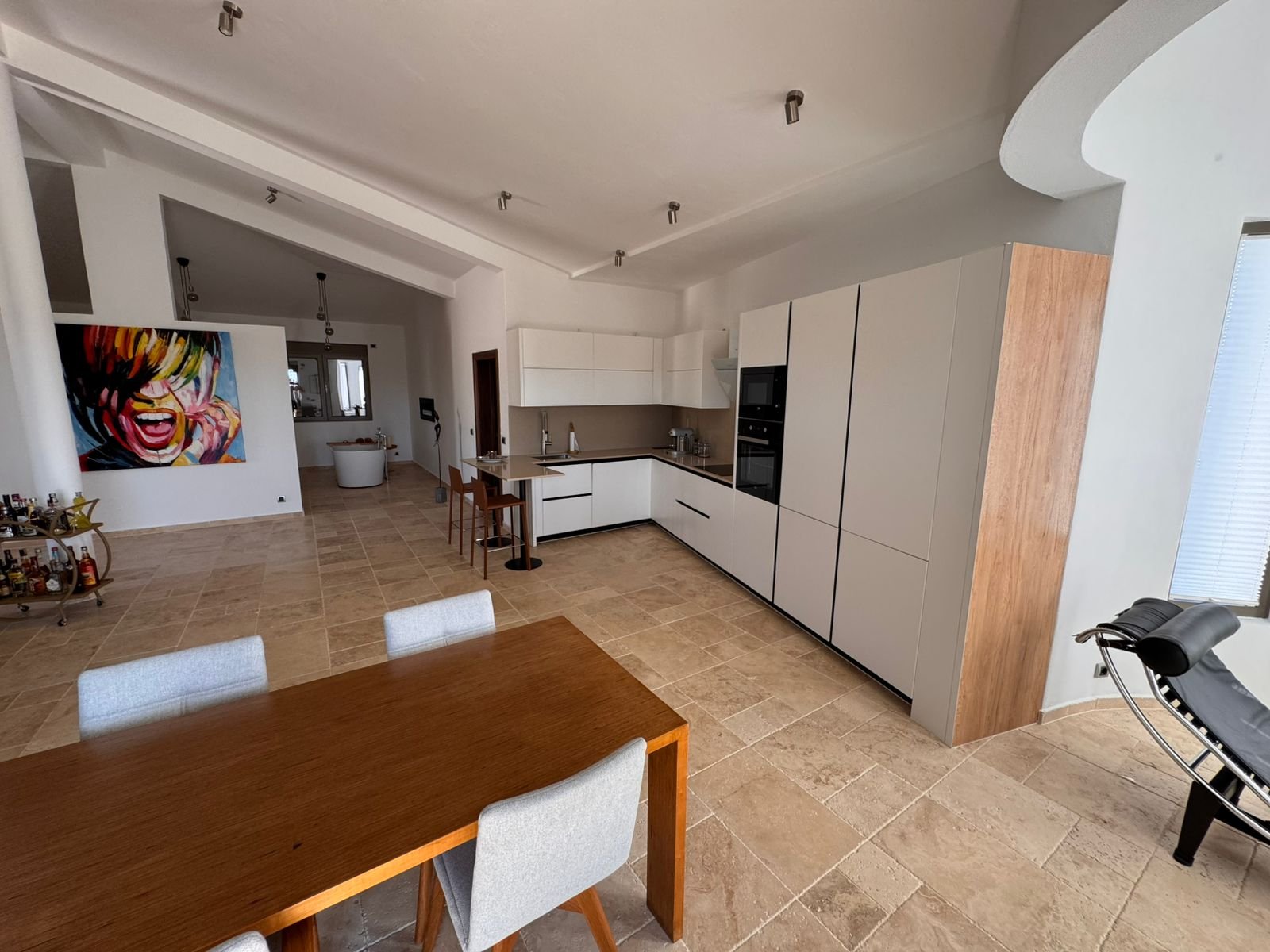 Stunning open-plan kitchen and dining in premium Ulcinj real estate with luxury finishes. Montenegro-listings.me by ekosphere doo.