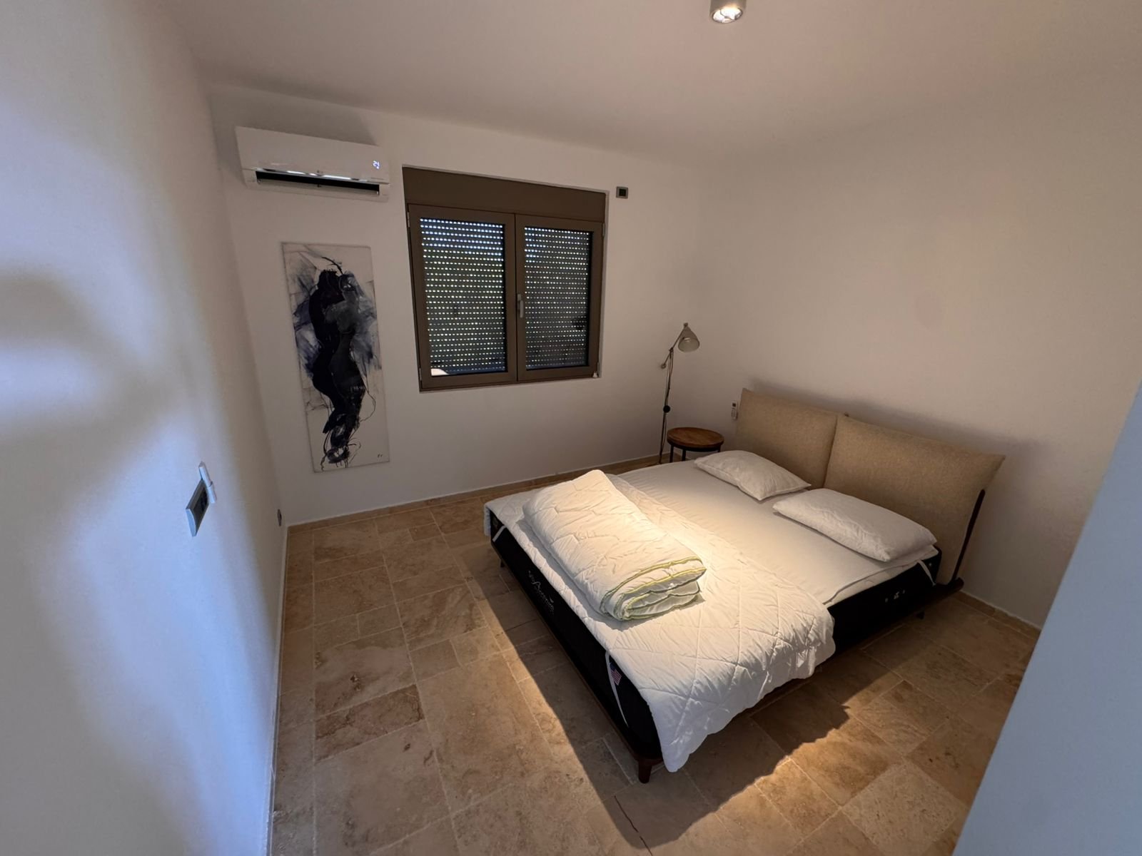 Modern Ulcinj bedroom with double bed, A/C, tiled floor&mdash;prime Montenegro listing by ekosphere doo. Ideal real estate investment.