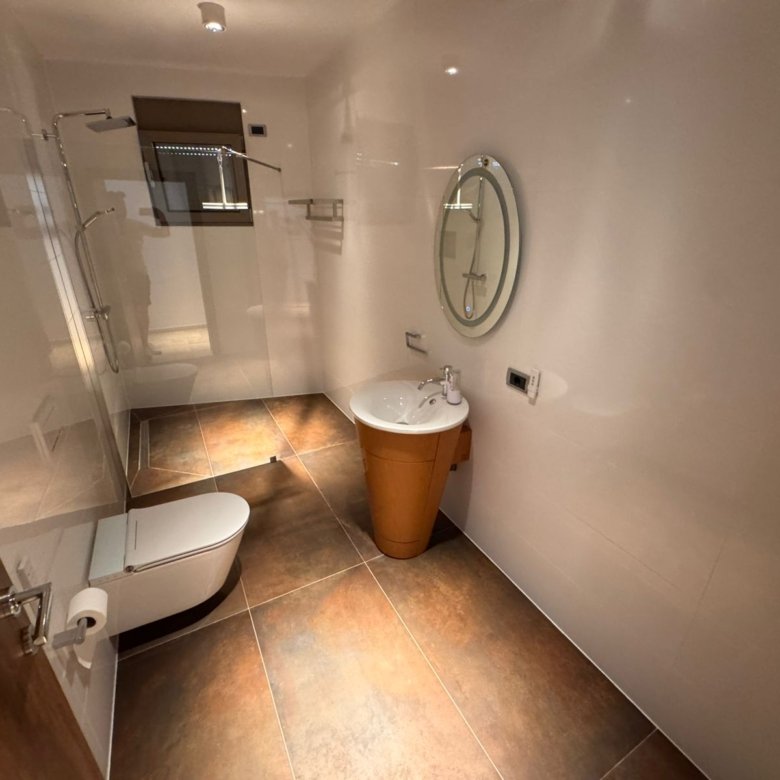 Luxury modern bathroom in Ulcinj by Ekosphere; sleek tiles, premium fixtures&mdash;exclusive listing on immorenta.me.