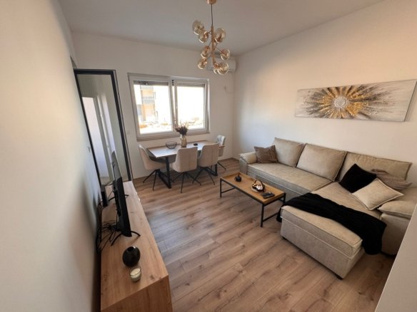 Elegant modern living room in Ulcinj with light wood floors and chic decor&mdash;exclusive Montenegro-listings.me property by Ekosphere DOO.