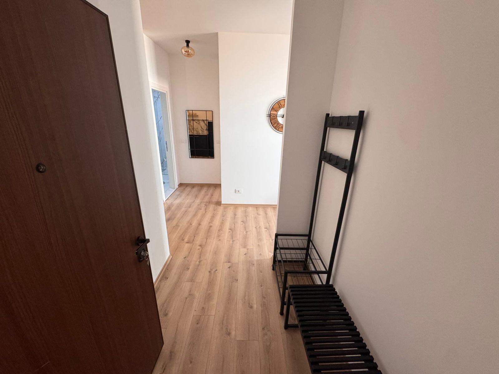 Bright hallway in Ulcinj property with light wood floors, modern accents; exclusive listing by immorenta.me, ekosphere doo.