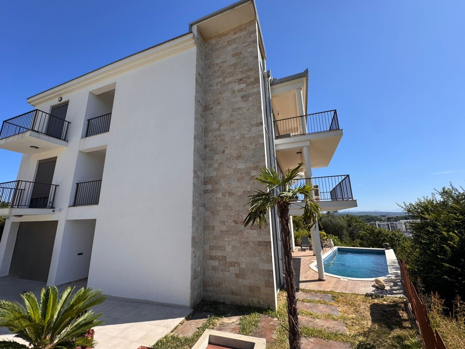 Exclusive three-story eco-friendly property in Ulcinj with balconies, pool, and lush gardens. Listed by immorenta.me (ekosphere doo).