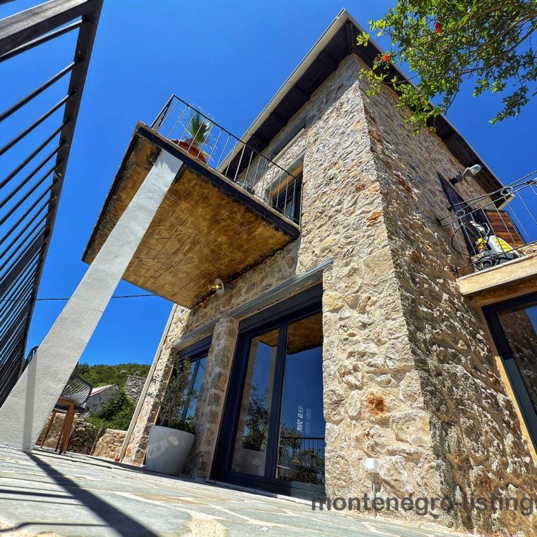 Listings for Sale - Stone villa in Ulcinj, Montenegro with large windows, metal-railed balcony; exclusive on immorenta.me by Ekosphere DOO.