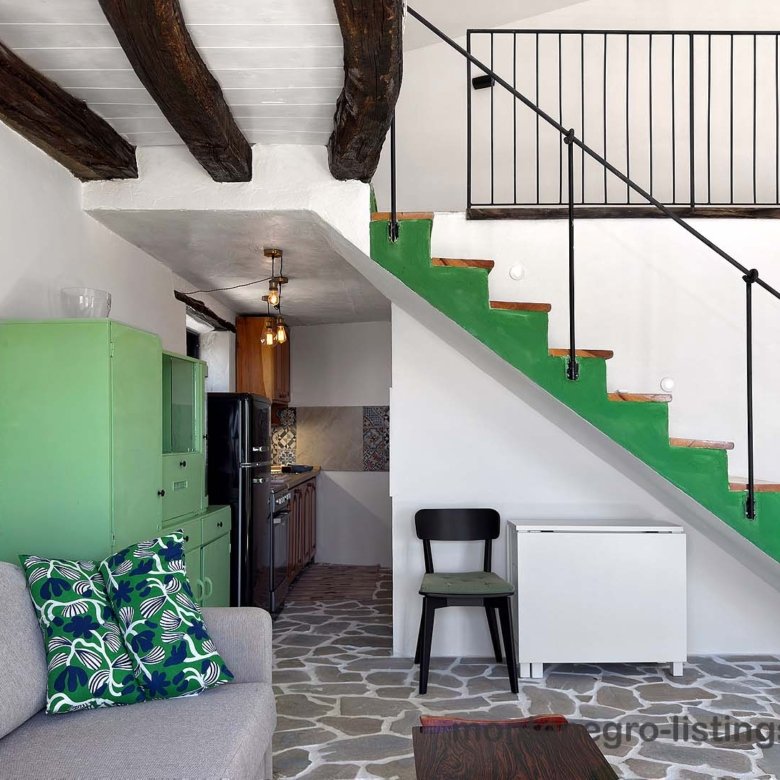 Stylish Ulcinj flat with green kitchen, exposed beams, and patterned tiles&mdash;ideal investment on immorenta.me by ekosphere doo.