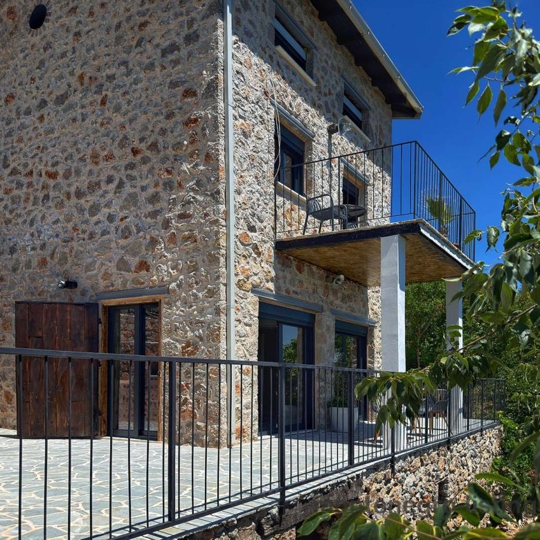 Elegant two-story stone house in Ulcinj, Montenegro&mdash;spacious balcony, glass doors, tiled patio. Exclusive on immorenta.me, a project by ekosphere doo.