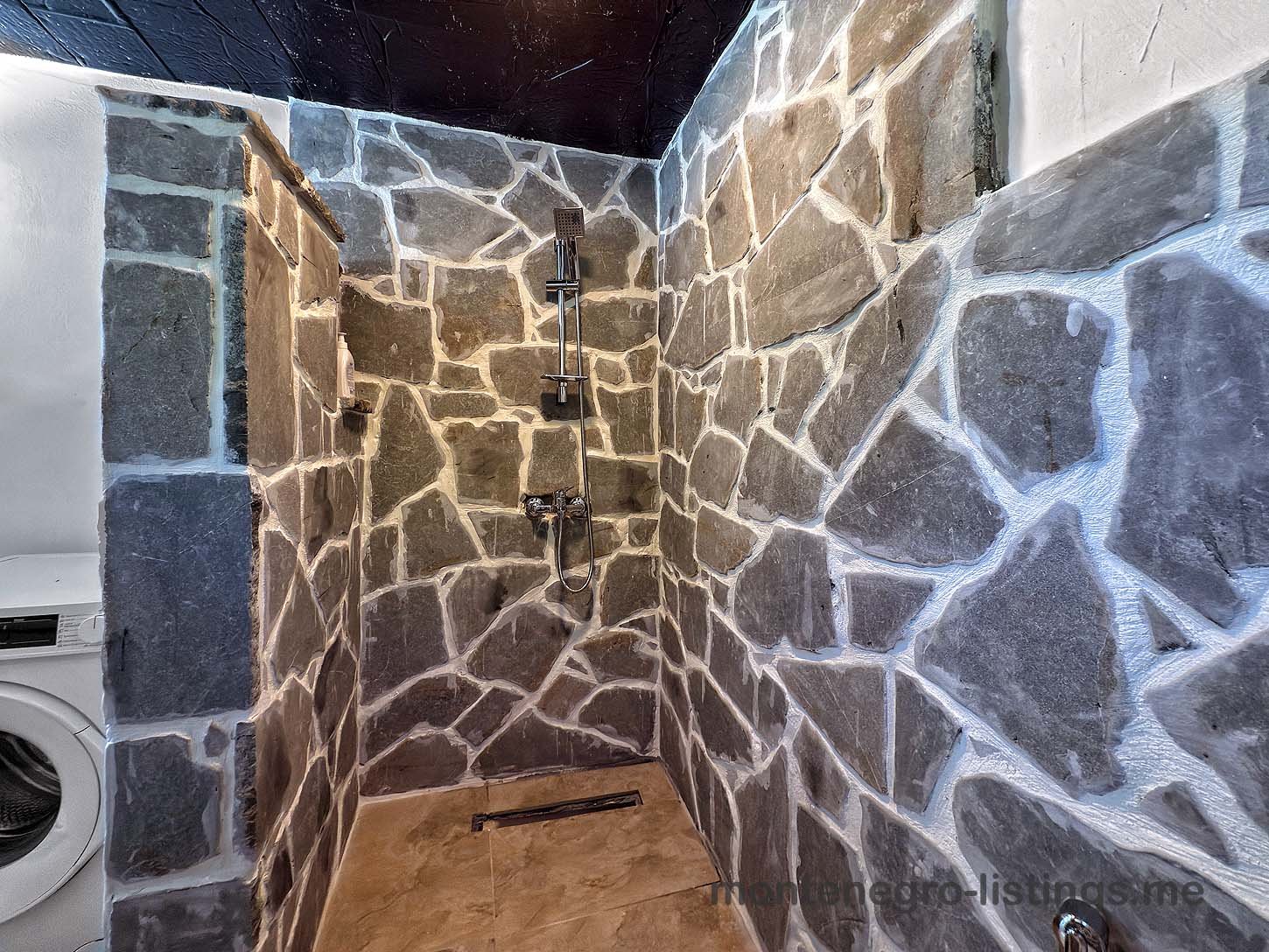 Luxurious Ulcinj shower: stylish stone tiles, rainfall shower, eco washing machine. Exclusive Ekosphere DOO on immorenta.me.
