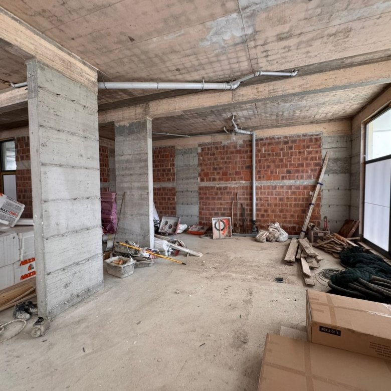 Spacious unfinished property in Ulcinj, Montenegro&mdash;concrete floors, exposed brick, large windows&mdash;ideal real estate investment. Featured on immorenta.me by Ekosphere doo.