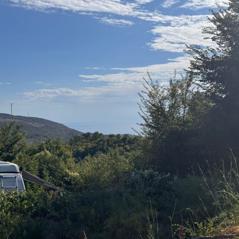 Prime Ulcinj Montenegro real estate site: lush greenery, hills, wind turbines, near properties by ekosphere doo at immorenta.me.