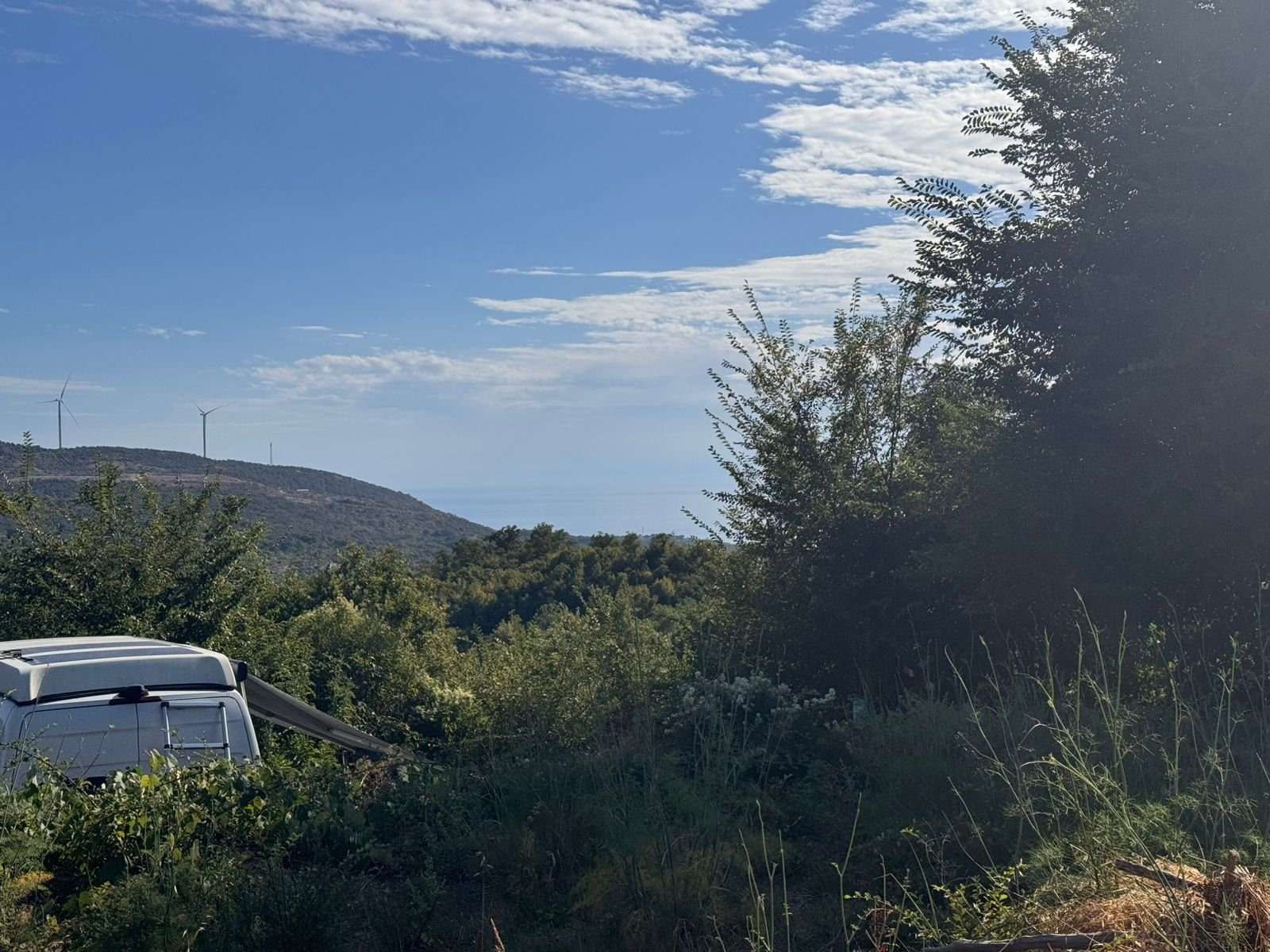 Prime Ulcinj Montenegro real estate site: lush greenery, hills, wind turbines, near properties by ekosphere doo at immorenta.me.