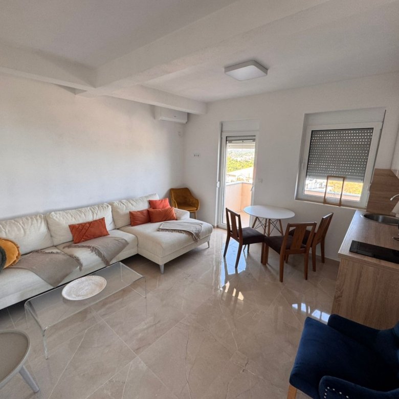 Stunning Ulcinj apartment: bright modern living, white sectional, designer kitchen by ekosphere doo. Invest in Montenegro property now!.