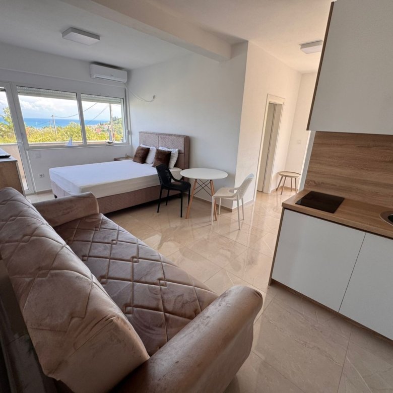 Modern studio in Ulcinj, Montenegro with mountain views, tiled floors, and stylish furnishings. Listed by ekosphere doo on immorenta.me.
