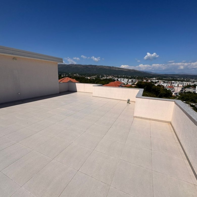 Expansive tiled rooftop terrace with panoramic Ulcinj views&mdash;ideal Montenegro real estate from Ekosphere doo at immorenta.me.