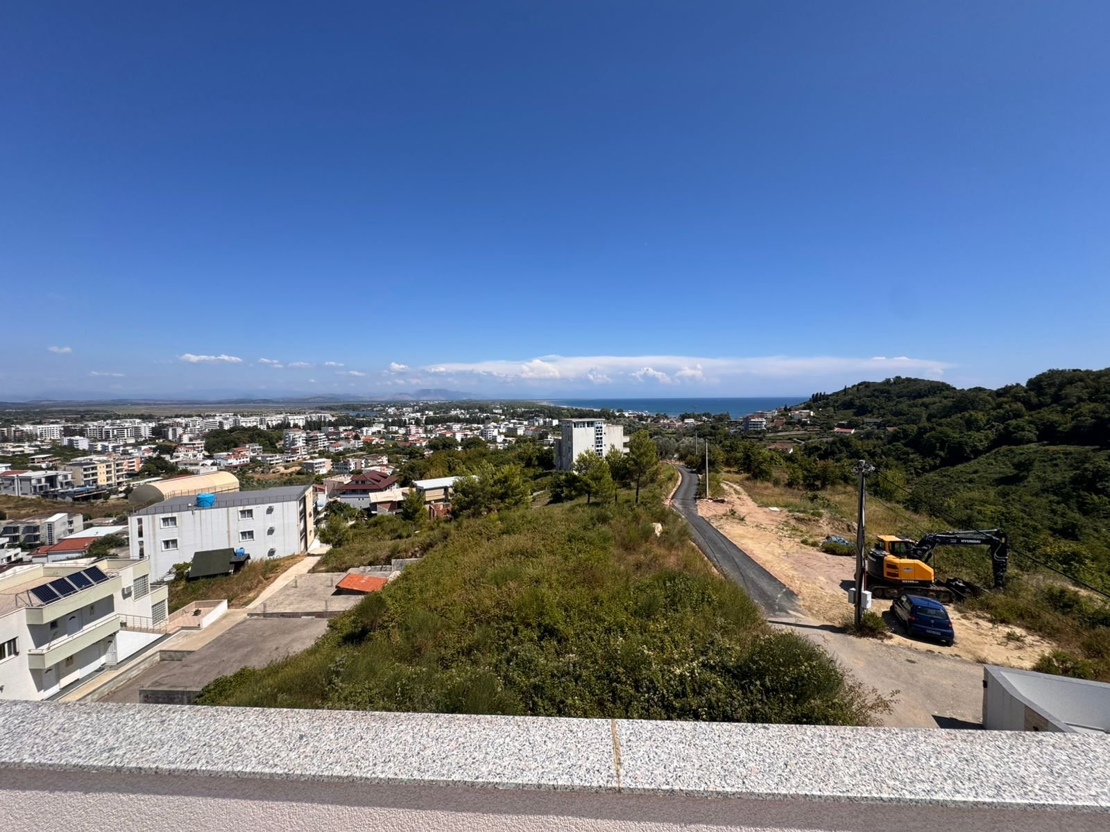 Panoramic rooftop view of Ulcinj, Montenegro: modern real estate, sea views, prime investment by ekosphere doo at immorenta.me.