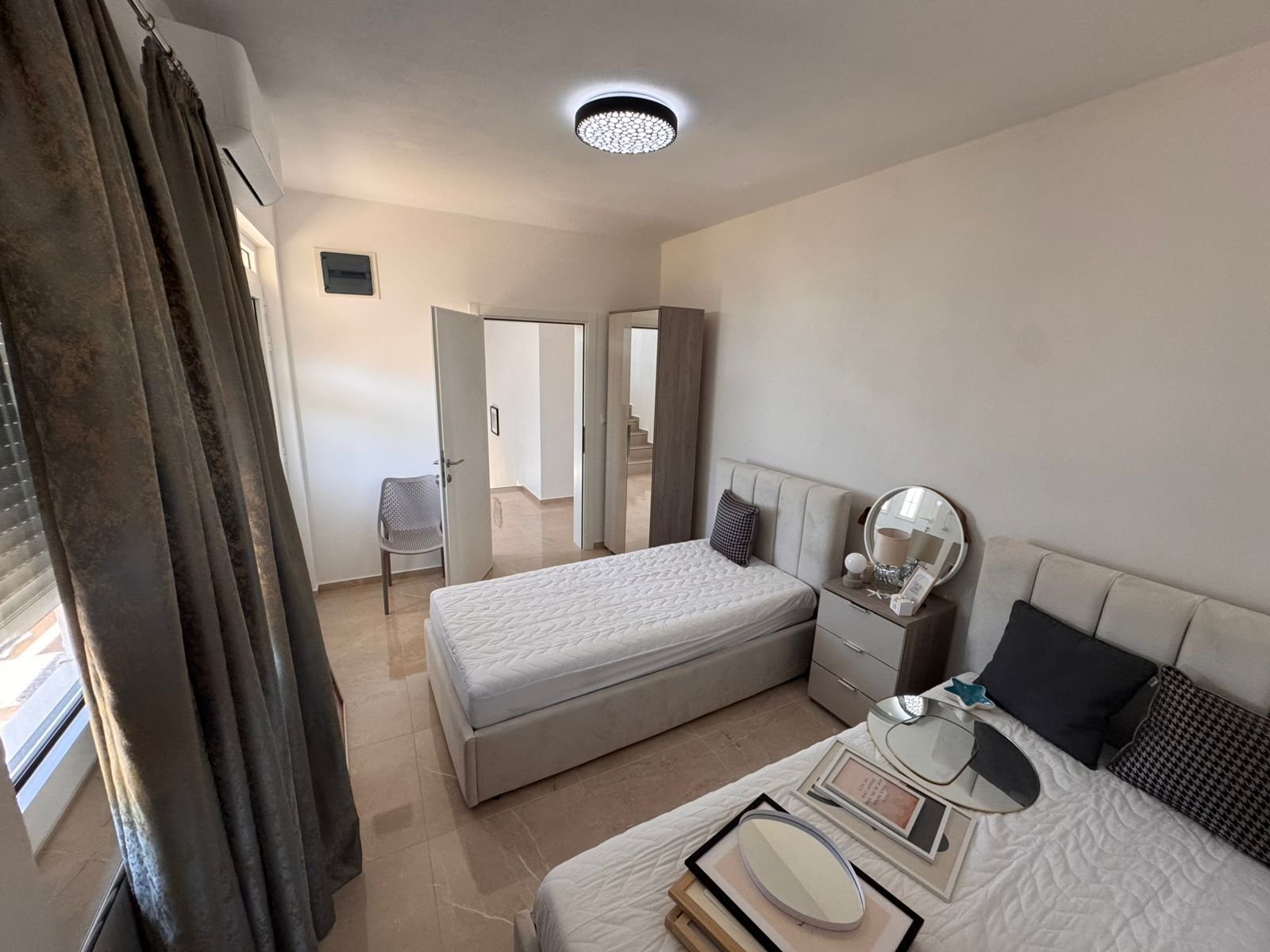 Modern Ulcinj bedroom&mdash;2 single beds, stylish d&eacute;cor, ideal Montenegro real estate investment. Exclusive by immorenta.me/Ekosphere.