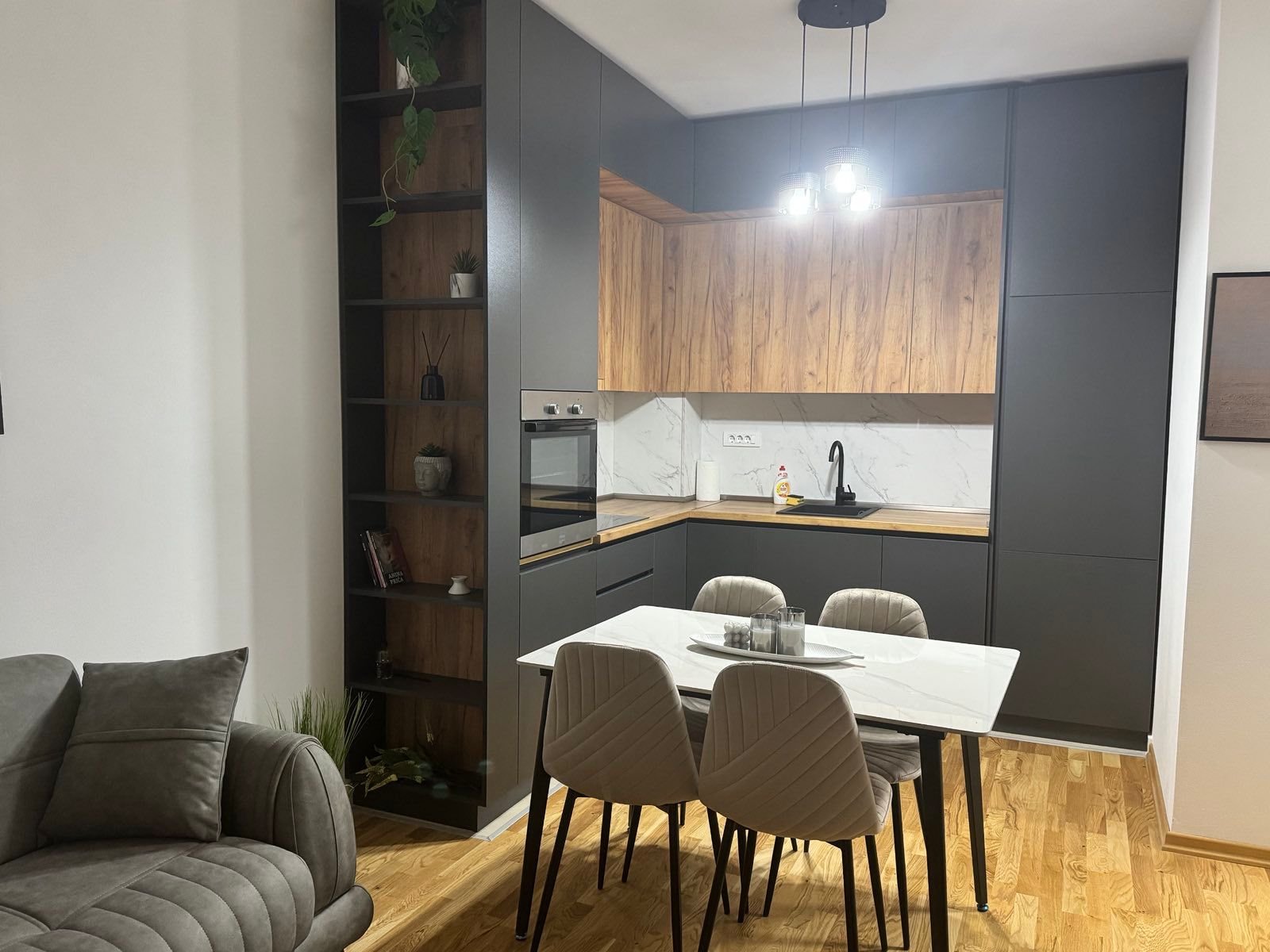 Stunning Ulcinj property features a modern kitchen, marble backsplash, and stylish living area&mdash;exclusive at immorenta.me.