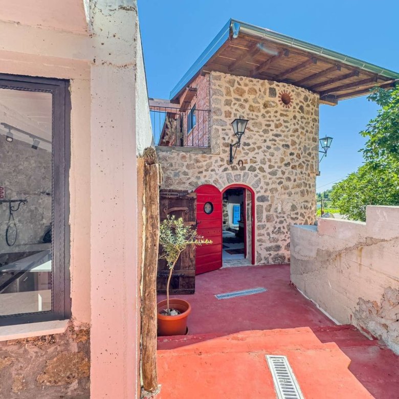 Charming stone house in Ulcinj with red door, wooden roof, patio, and garden&mdash;ideal investment on immorenta.me by ekosphere doo.