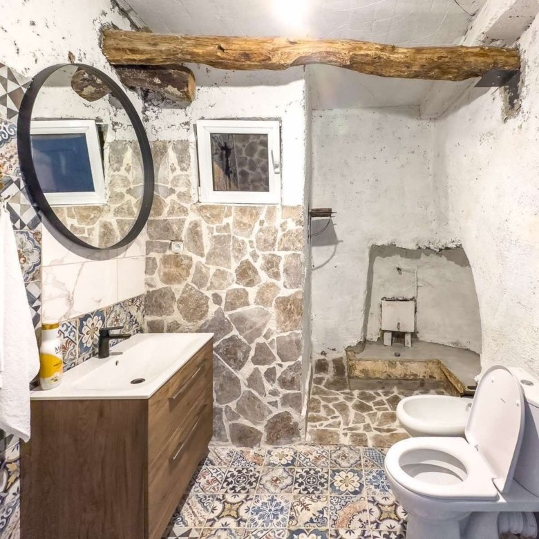 Discover a stunning Ulcinj bathroom with rustic stone accents, wood vanity, and luxury finishes&mdash;exclusive on immorenta.me by ekosphere doo.