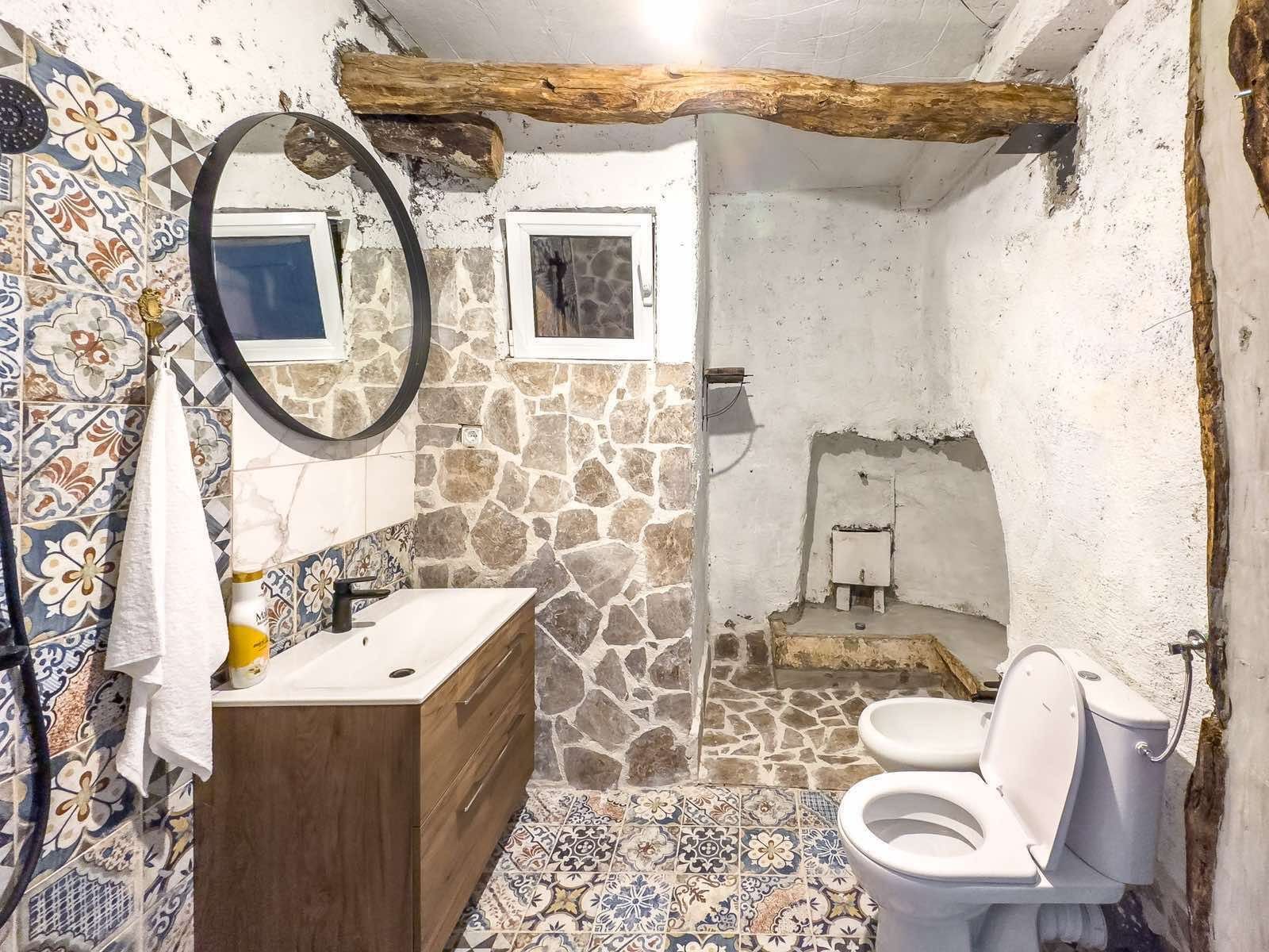 Discover a stunning Ulcinj bathroom with rustic stone accents, wood vanity, and luxury finishes&mdash;exclusive on immorenta.me by ekosphere doo.
