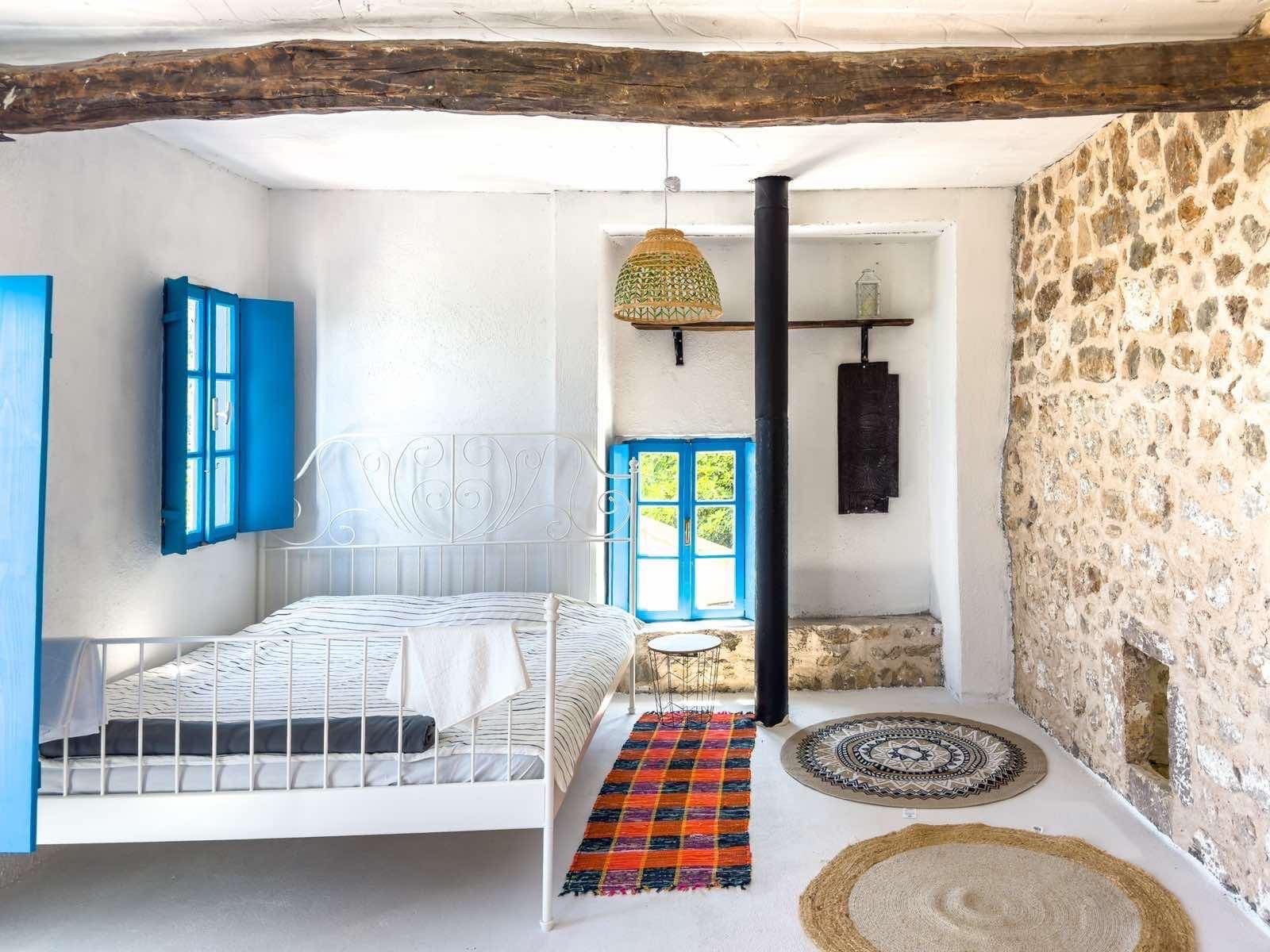 Real Estate Financing Charming rustic bedroom in Ulcinj, stone accents, sunlit windows & premium finishes&mdash;exclusive on immorenta.me by ekosphere doo.
