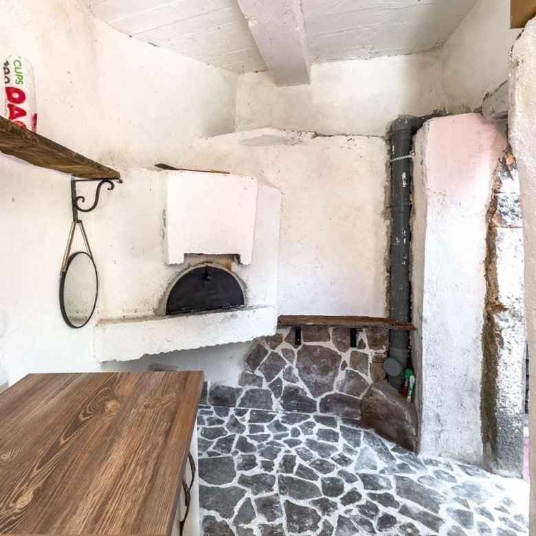 Charming rustic kitchen in Ulcinj with stone floors, wood counters, built-in oven&mdash;prime Montenegro investment on immorenta.me by ekosphere doo.
