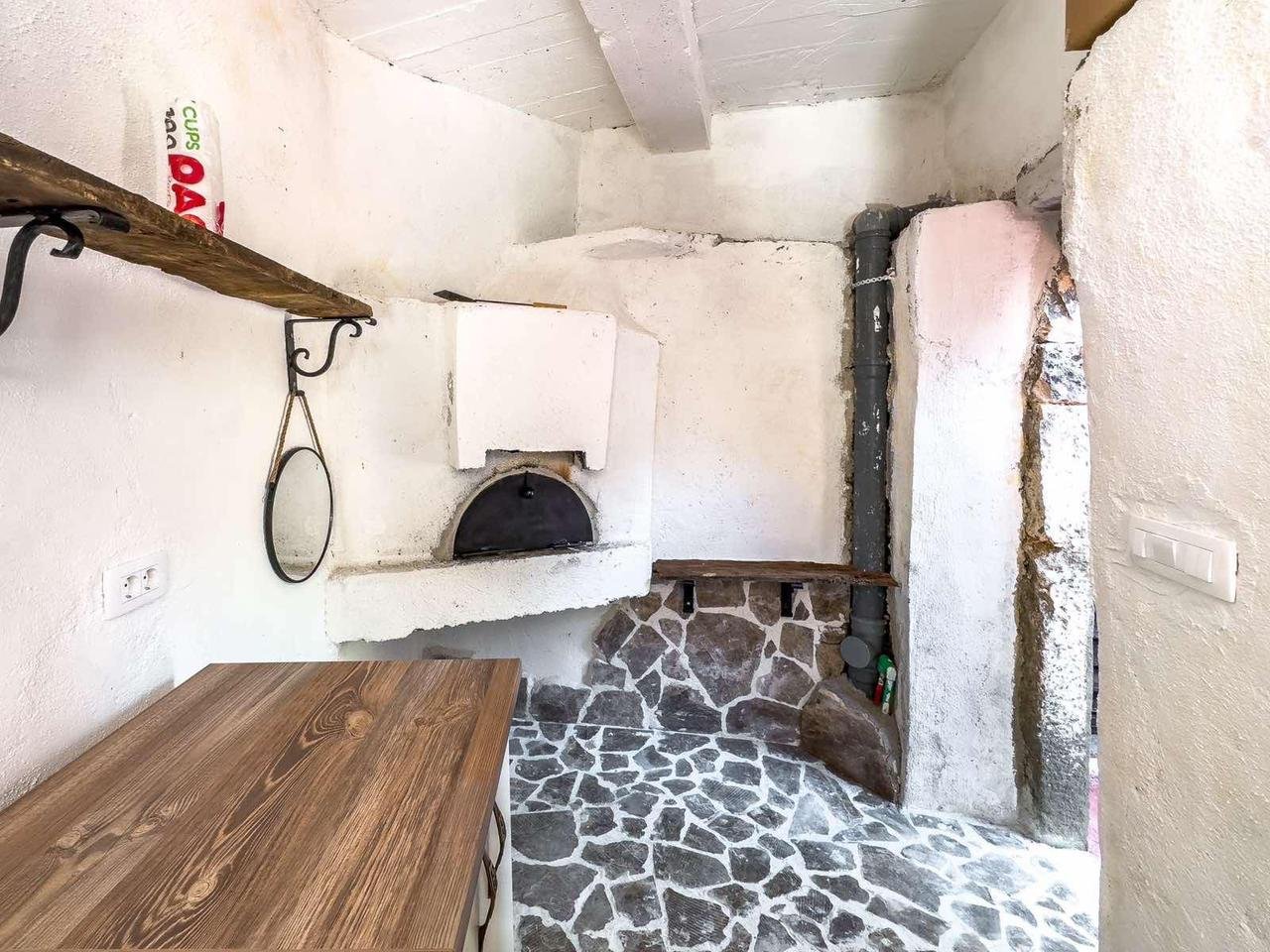 Charming rustic kitchen in Ulcinj with stone floors, wood counters, built-in oven&mdash;prime Montenegro investment on immorenta.me by ekosphere doo.