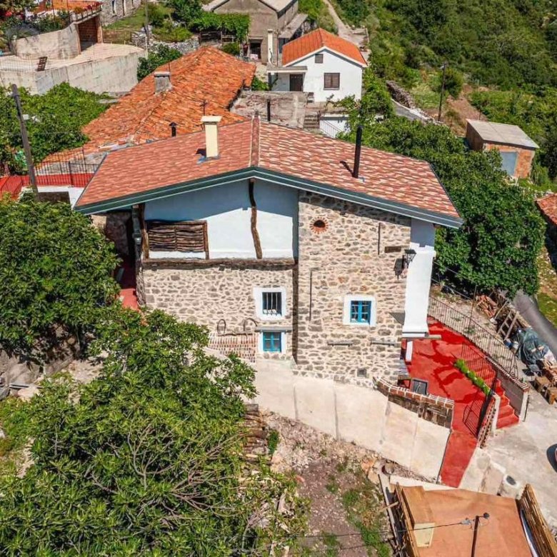 Ulcinj Real Estate Discover a traditional stone house with red-tiled roof in hilly, green Ulcinj&mdash;prime real estate on immorenta.me by ekosphere doo.