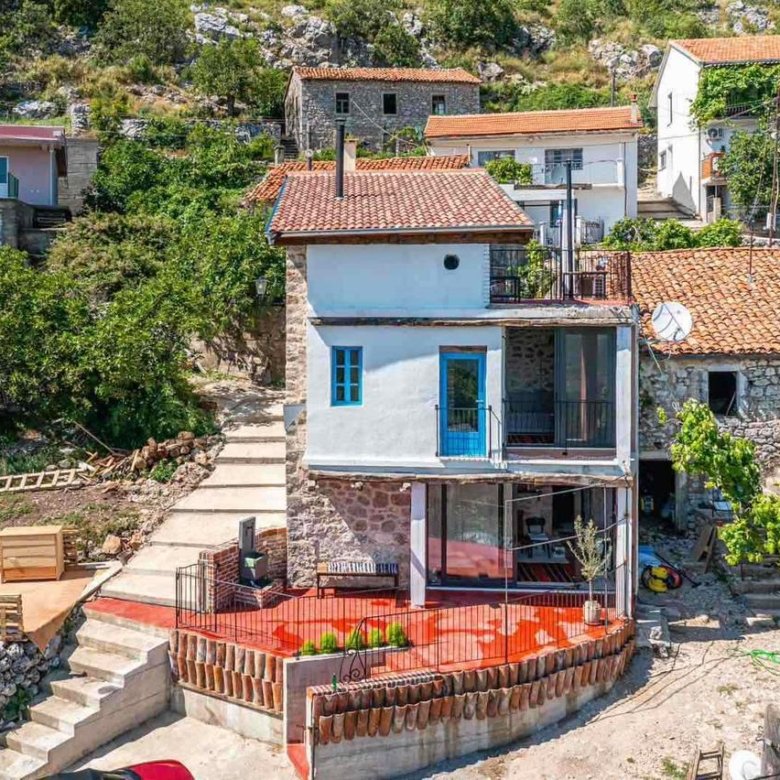 Stunning two-story stone house in Ulcinj with red-tiled roof, blue accents, lush yard, patio&mdash;exclusive at immorenta.me by ekosphere doo.