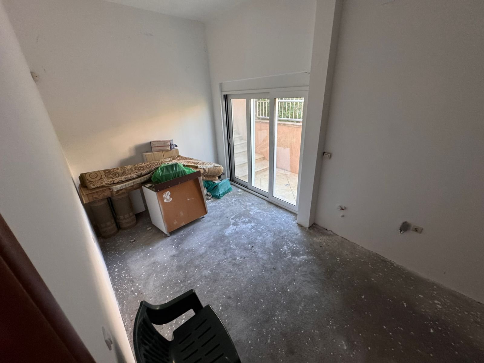 Spacious, versatile room in Ulcinj with concrete floors and outdoor access&mdash;ideal for investors. Discover more at immorenta.me by ekosphere doo.