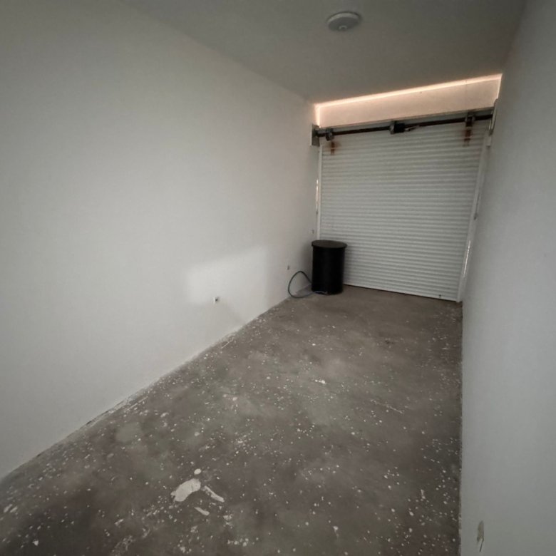 Modern, secure garage in Ulcinj, Montenegro&mdash;ideal investment. Clean, lit space with concrete floor; see more on immorenta.me by ekosphere doo.