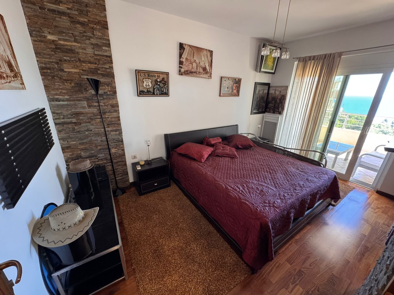 Modern Ulcinj bedroom with sea-view balcony, quality wood floors, elegant double bed&mdash;ideal Montenegro investment at immorenta.me.