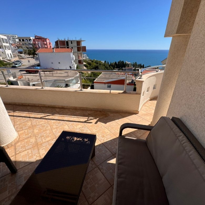 Luxury tiled balcony in Ulcinj with sea view, modern outdoor lounge, and prime investment appeal. Montenegro-listings.me by ekosphere doo.