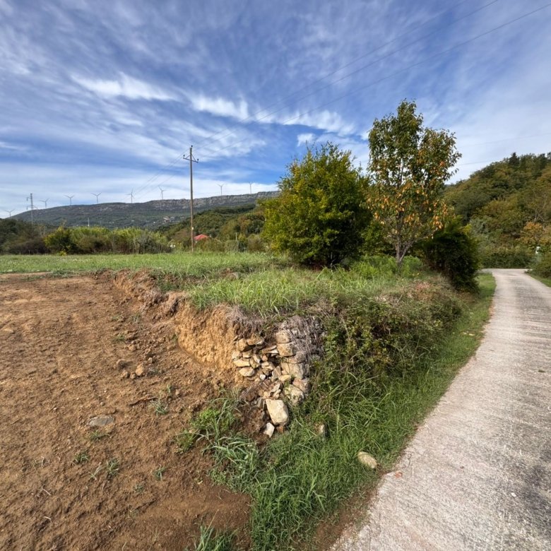 Premium Ulcinj land: paved road access, lush greenery, tilled fields & wind turbines&mdash;exclusive at immorenta.me by ekosphere doo.