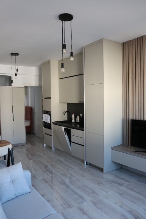 Luxury modern kitchen in Ulcinj, Montenegro with marble floors, top appliances, designer lighting. Invest via immorenta.me by ekosphere doo.