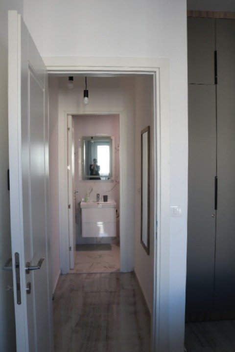 Elegant Ulcinj property: Bright hallway with modern bathroom, quality fixtures, spacious wardrobe. Exclusive on immorenta.me by ekosphere doo.