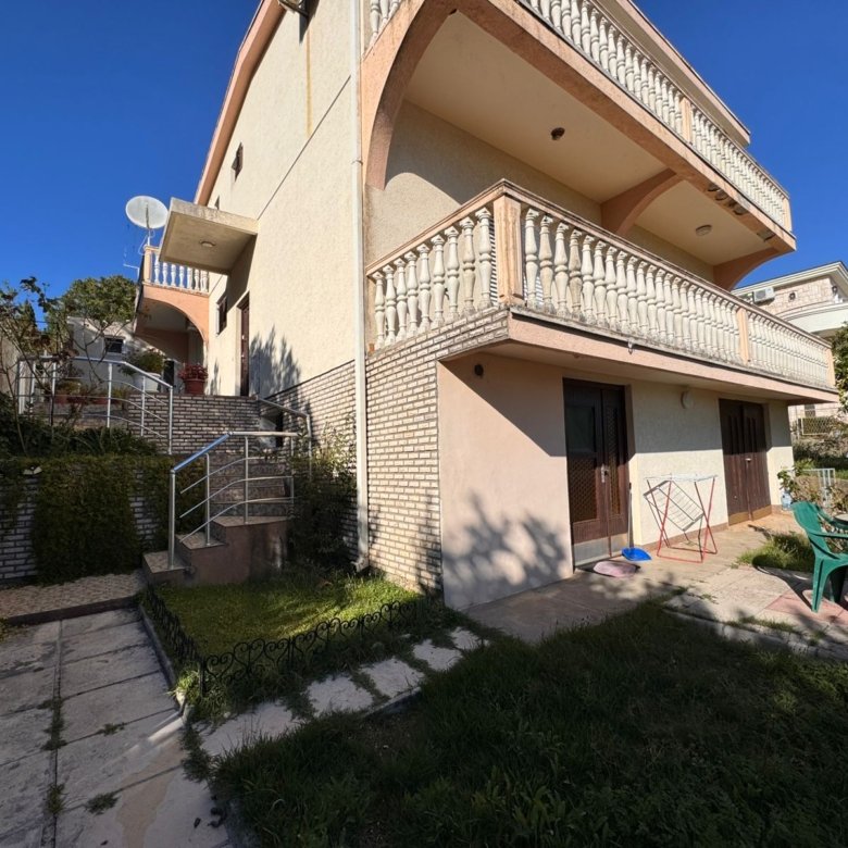 Modern two-story beige house in Ulcinj with balconies, patio, and garden&mdash;prime investment via immorenta.me by ekosphere doo.