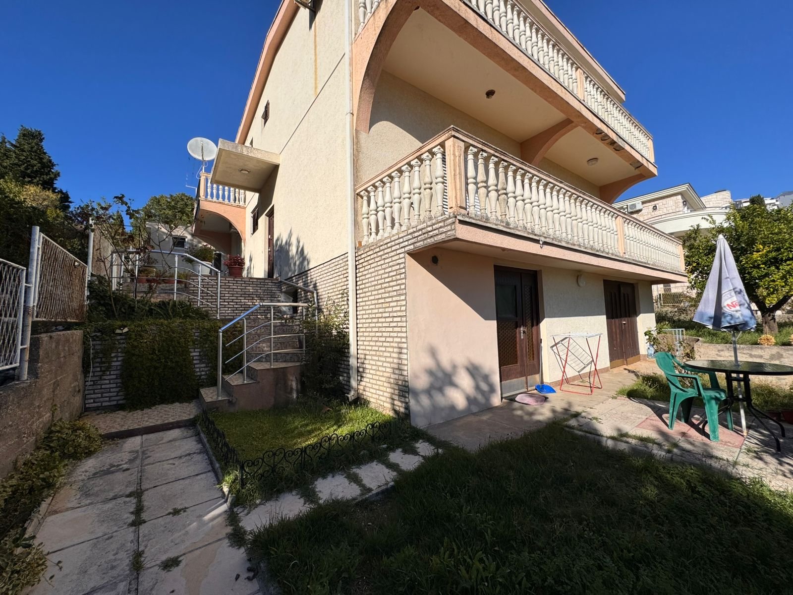 Modern two-story beige house in Ulcinj with balconies, patio, and garden&mdash;prime investment via immorenta.me by ekosphere doo.