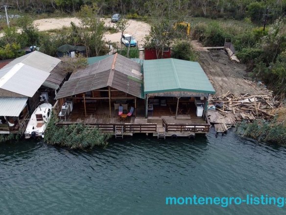 Exclusive aerial view of Ulcinj waterfront homes with private boat docks, lush nature, and investment potential at immorenta.me.