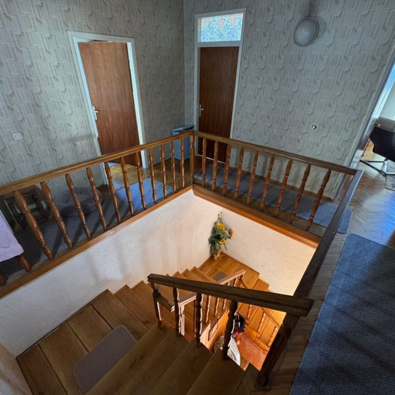 Elegant wooden staircase with banister, stylish entryway, and designer touches in prime Ulcinj home by immorenta.me/Ekosphere doo.