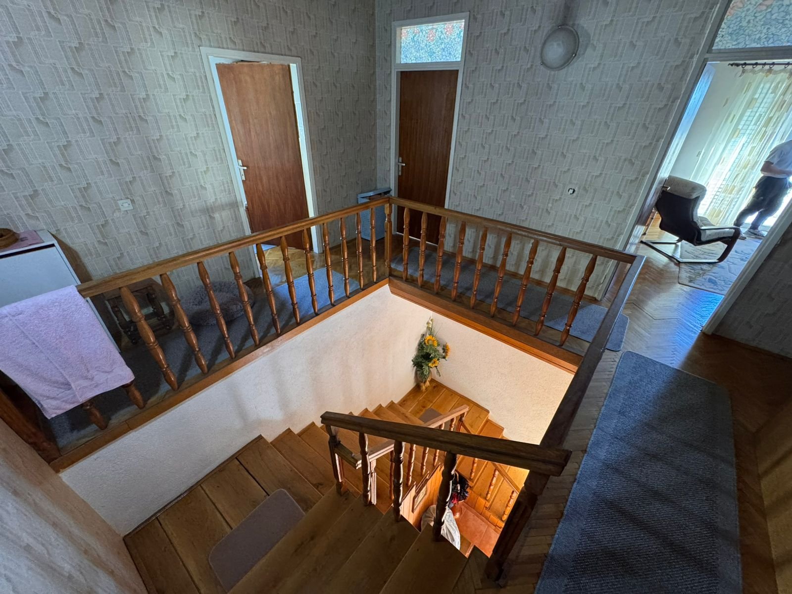 Elegant wooden staircase with banister, stylish entryway, and designer touches in prime Ulcinj home by immorenta.me/Ekosphere doo.