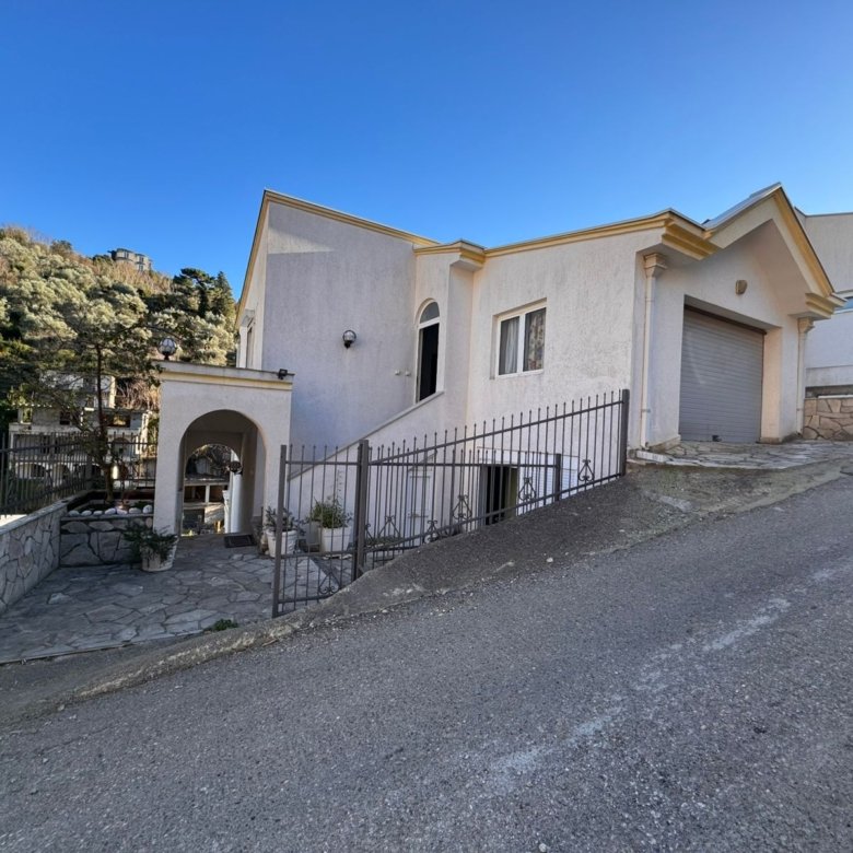 Charming white single-story home in Ulcinj, Montenegro, with patio, garage, gated entry&mdash;prime investment via immorenta.me.
