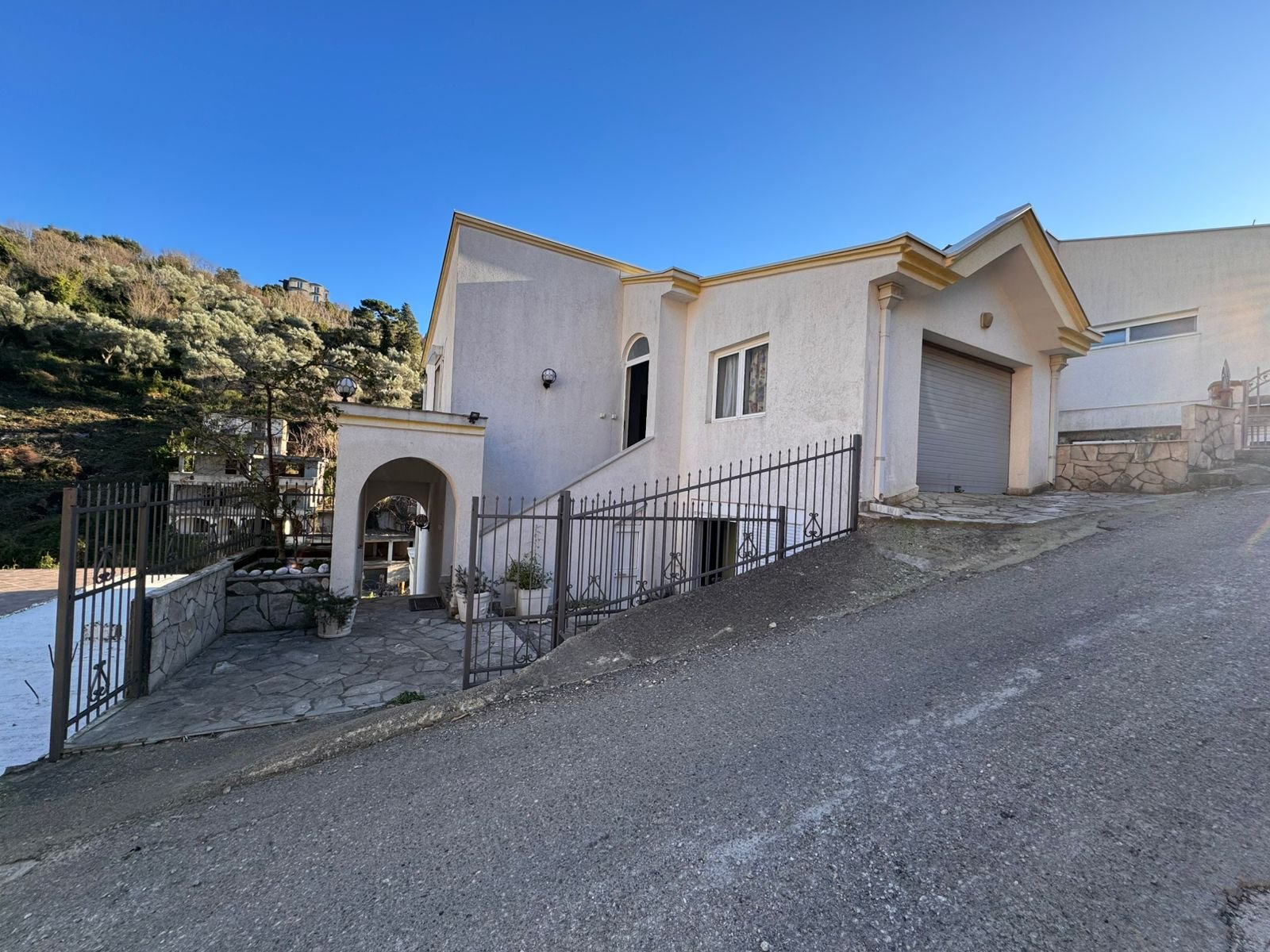 Charming white single-story home in Ulcinj, Montenegro, with patio, garage, gated entry&mdash;prime investment via immorenta.me.
