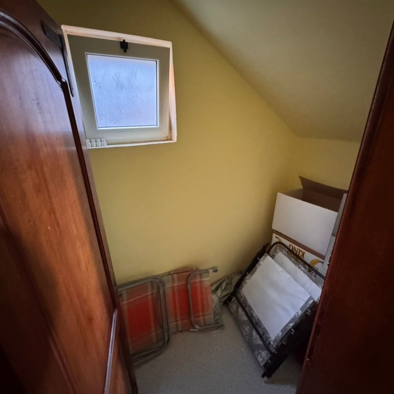 Bright, cozy room with yellow walls, open window, and ample storage potential&mdash;ideal Ulcinj investment via immorenta.me by ekosphere doo.