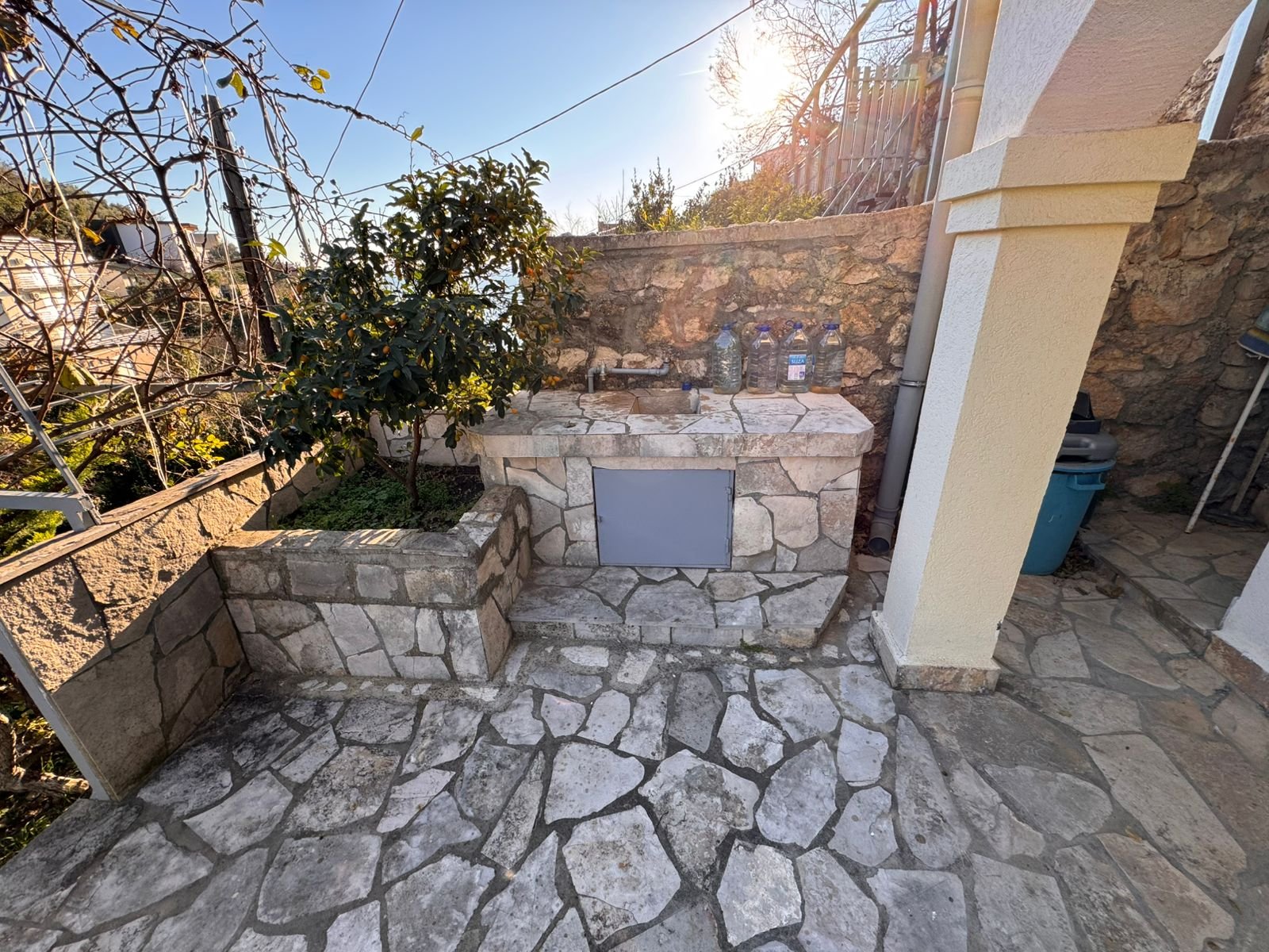 Stunning stone outdoor sink on a sunlit patio in Ulcinj, Montenegro&mdash;ideal investment. Montenegro-listings.me by ekosphere doo.