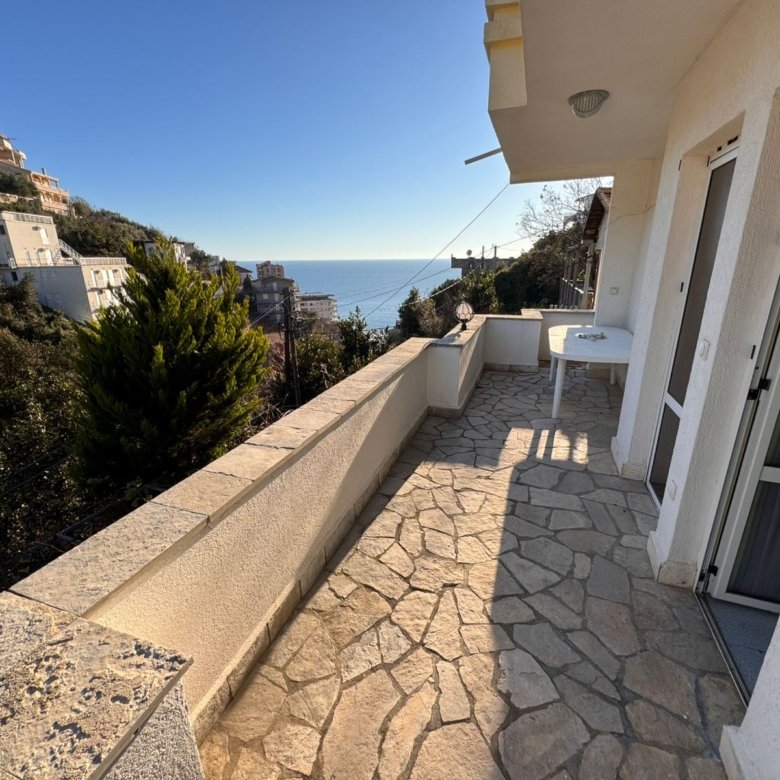 Experience Ulcinj luxury: stone-tiled balcony, panoramic sea views, lush hills, prime real estate by ekosphere doo via immorenta.me.