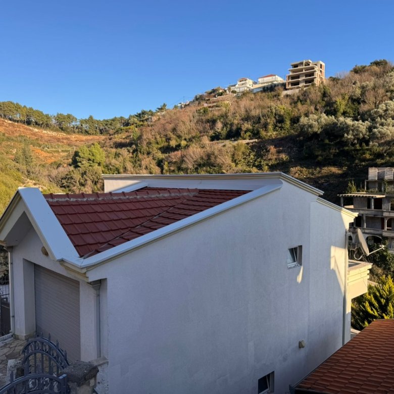 Charming white house with red-tiled roof in Ulcinj, overlooking lush hills&mdash; prime Montenegro property on immorenta.me by ekosphere doo.