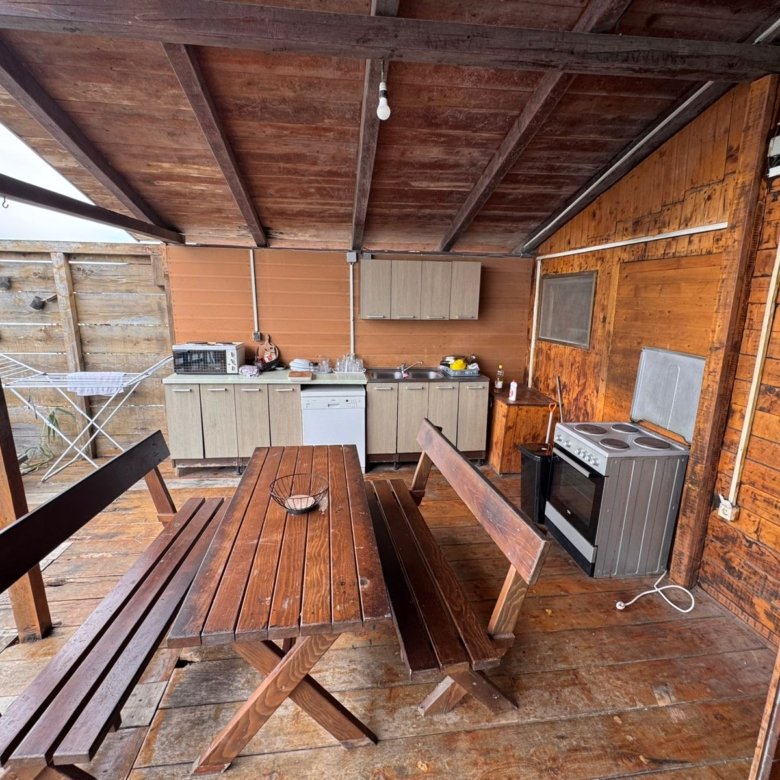 Charming rustic outdoor kitchen in Ulcinj with wood floors, dining set, appliances&mdash;ideal Montenegro investment. On immorenta.me.